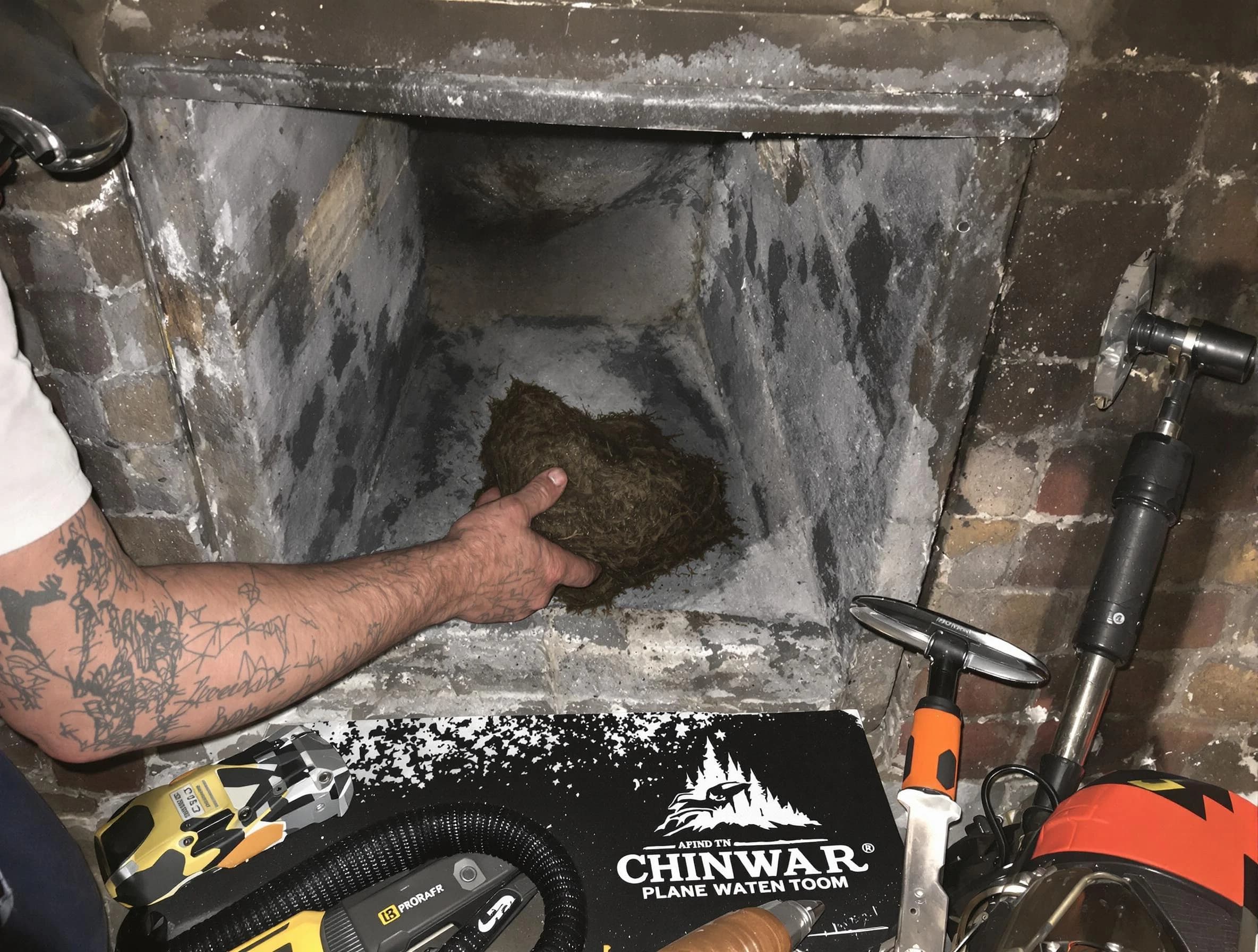 Loveland Chimney Sweep safely removing debris and screening chimney in Loveland, CO